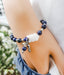 Blue lapis lazuli stretch bracelet with three white glass chevrons