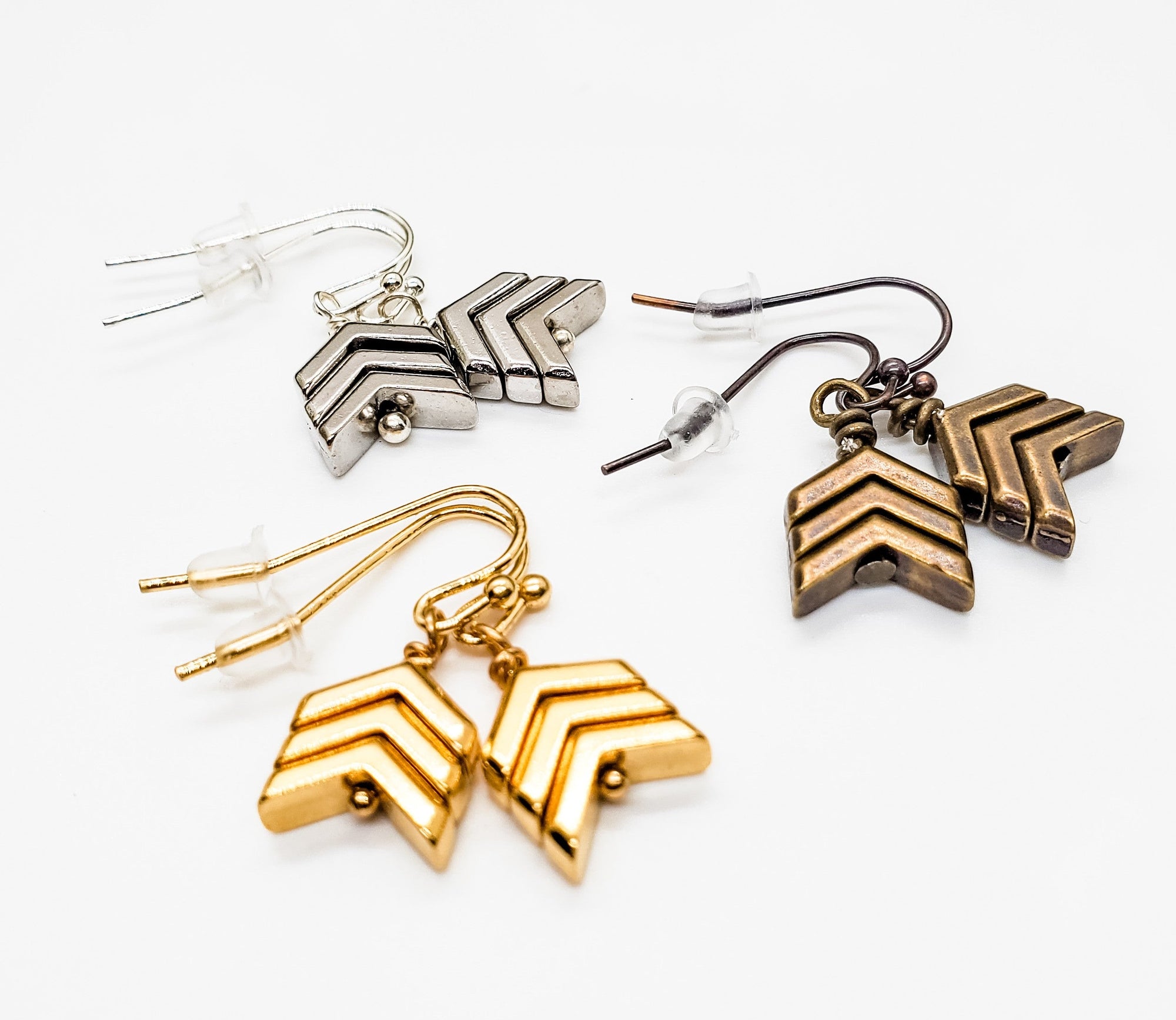 Simple in design, but big on Everyday Awareness. Gold, Silver, or Bronze chevron earrings are placed on sterling silver or gold filled ear wires. - Down Syndrome Boutique
