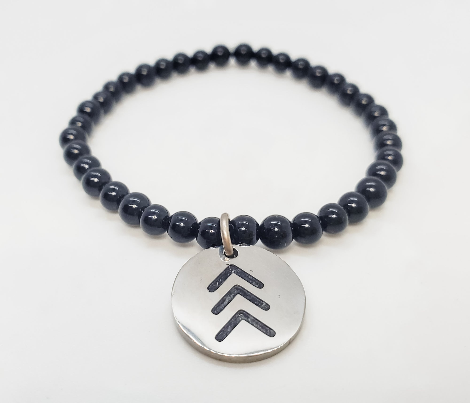 The Lucky Few black onyx charm bracelet that celebrates and promotes inclusivity in style - Down Syndrome Boutique
