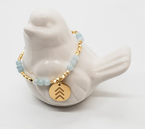 Trendy! Genuine light aquamarine beads and gold or silver nugget beads with chevron charm. - Down Syndrome Boutique