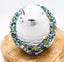 Three tiny chevrons surrounded by sparkling blue and yellow beads. Perfect for Everyday Awareness!