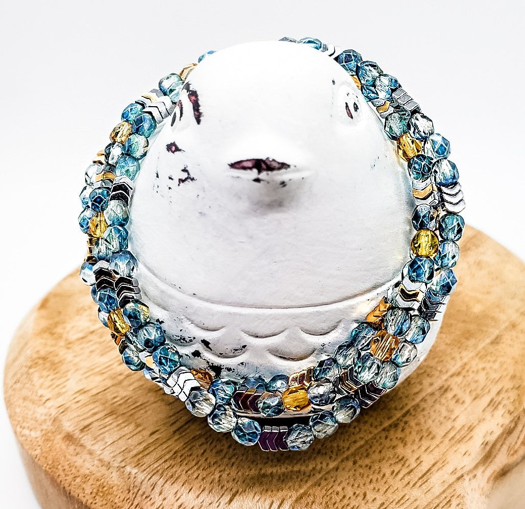 Three tiny chevrons surrounded by sparkling blue and yellow beads. Perfect for Everyday Awareness! - Down Syndrome Boutique
