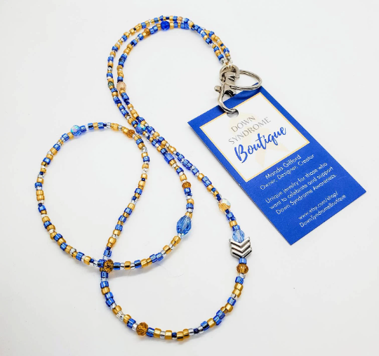 Classically colored blue and yellow glass seed beads make this strong lanyard and features silver or gold chevrons - Down Syndrome Boutique