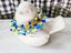 Fun and versatile seed bead wrap bracelet that features the chevron TRIBE charm - Down Syndrome Boutique