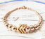 Minimal design. Maximum impact. 14k Gold filled beaded bracelet with 3 gold chevrons.