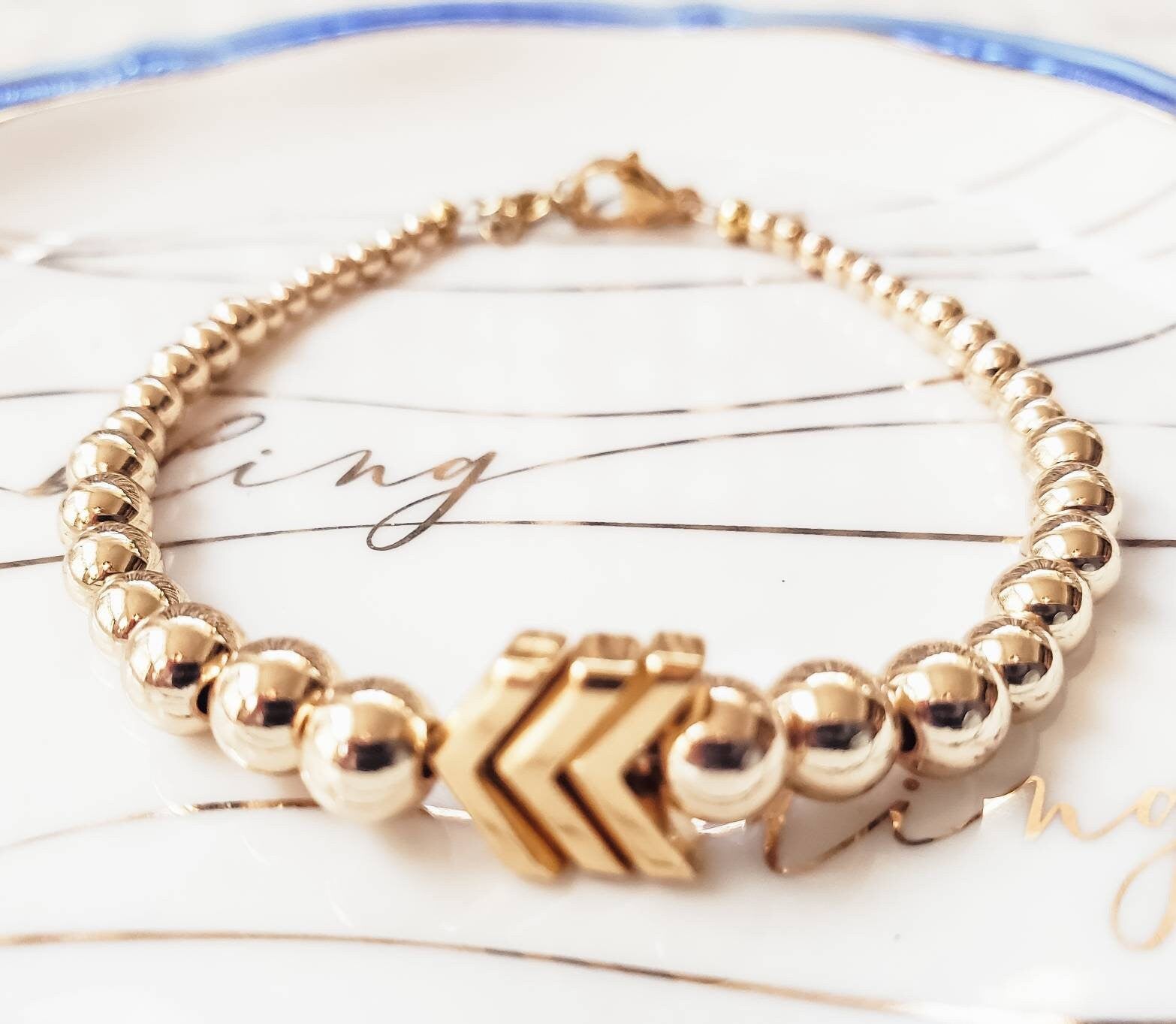 Minimal Design. Maximum Impact. 14K Gold Filled Beaded Bracelet with 3 Gold Plated Chevrons. M (6.5 - 7.5) Inches