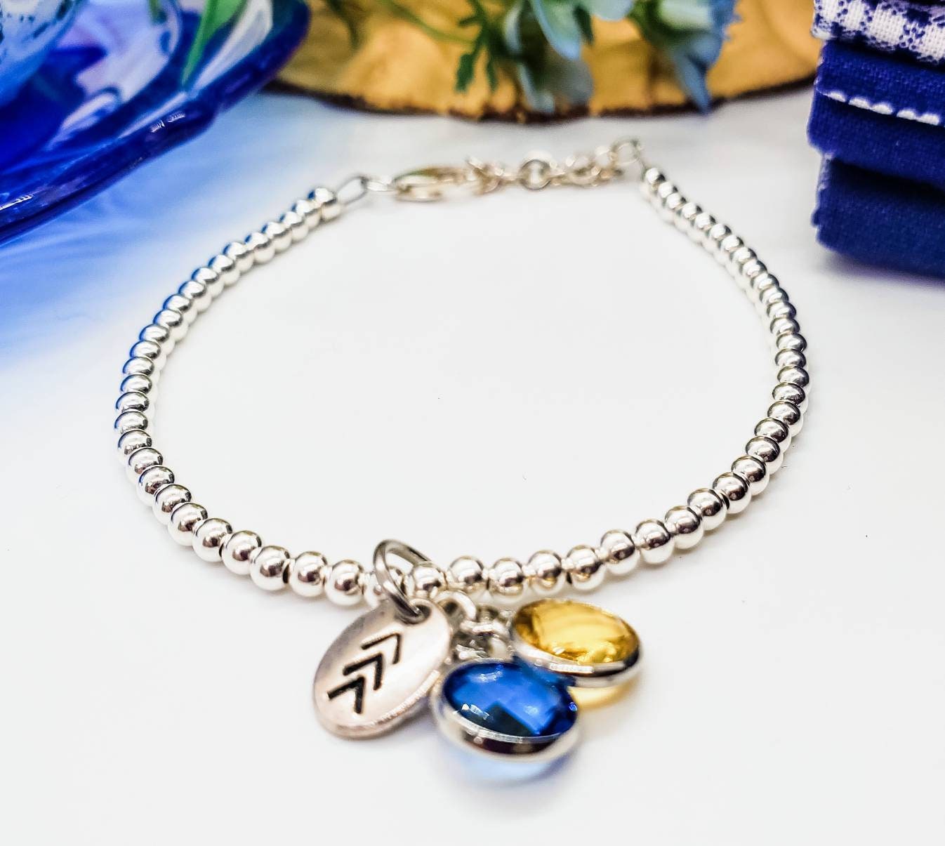 Sterling Silver beaded bracelet with blue and yellow charms, Hand stamped chevron charm, Down Syndrome Gift, The Lucky Few, charm bracelet - Down Syndrome Boutique